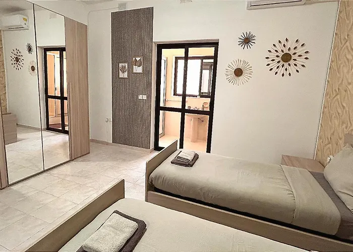 Arzella Xlendi, Premium 2br, Bus Stop & Market Opposite Séjour chez l'habitant